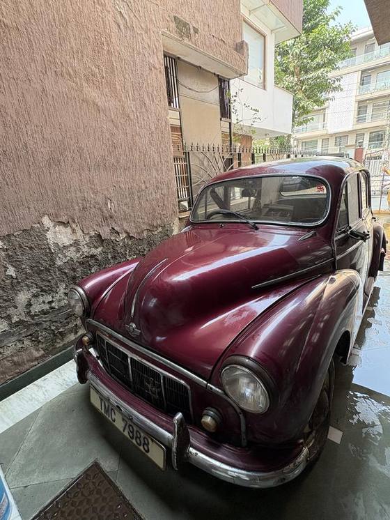Maroon Morris Minor 1000 four-door saloon for sale in Gurgaon, front three-quarter view